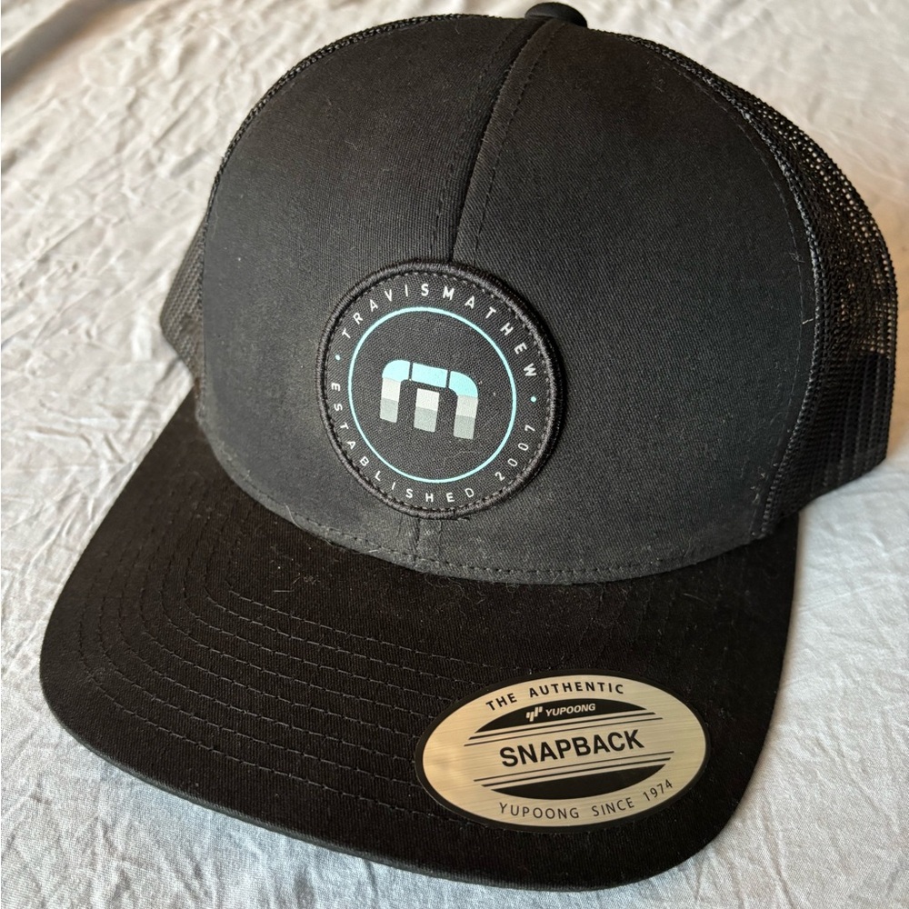 Travis Mathew Black Snapback Hat